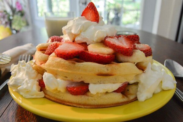 Waffles with whipped cream and strawberries St Francis Cottage
