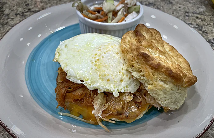 BarBQ Chicken Breakfast biscuit with a side of slaw